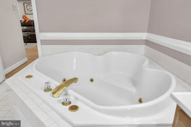 a kitchen with stainless steel appliances granite countertop a refrigerator and a stove