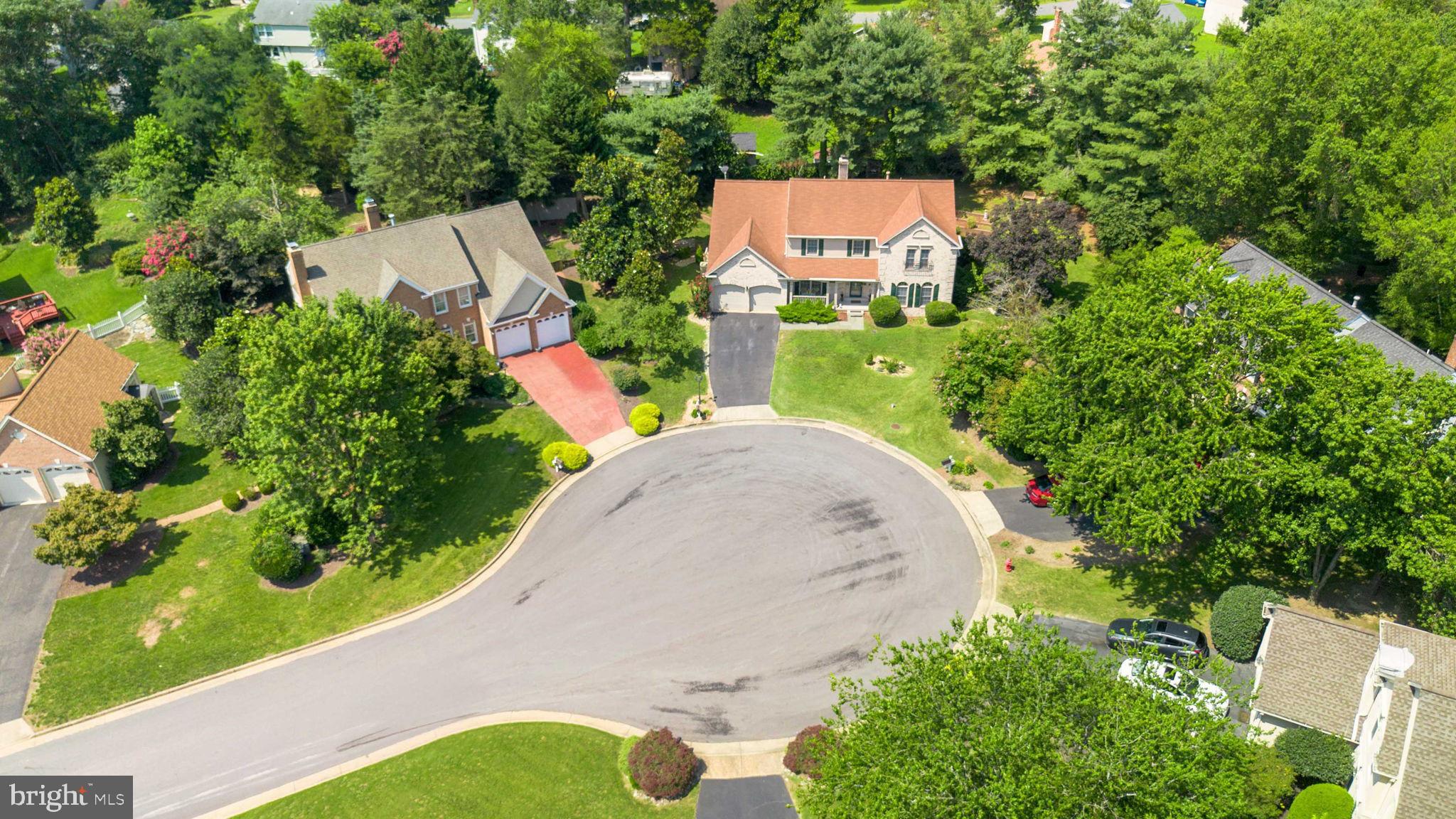 10404 Amherst Circle Fredericksburg, VA 22408 - Photo 4 of 74 an aerial view of a house with a yard and trees