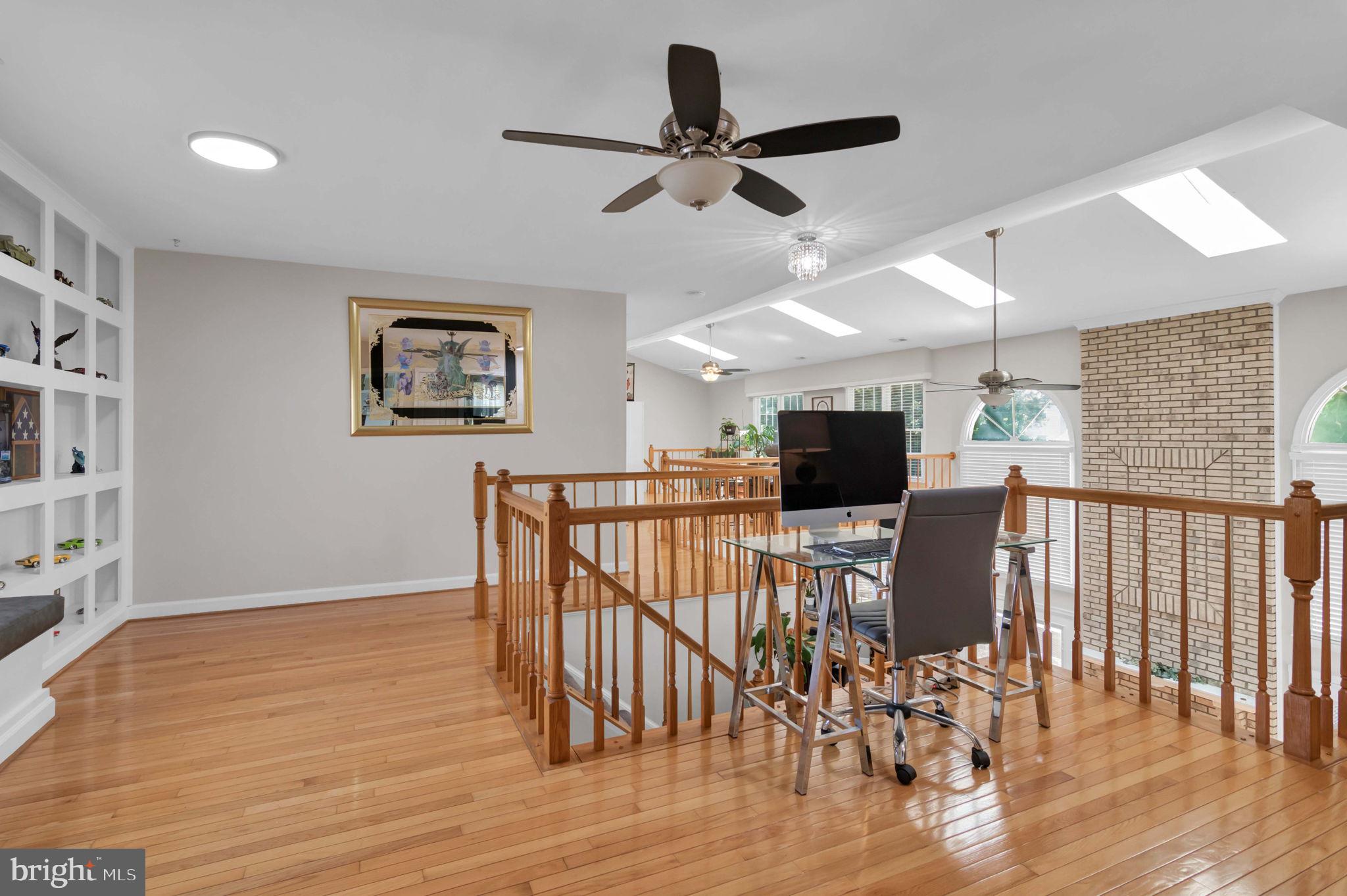 10404 Amherst Circle Fredericksburg, VA 22408 - Photo 42 of 74 a view of a livingroom with furniture a ceiling fan and wooden floor