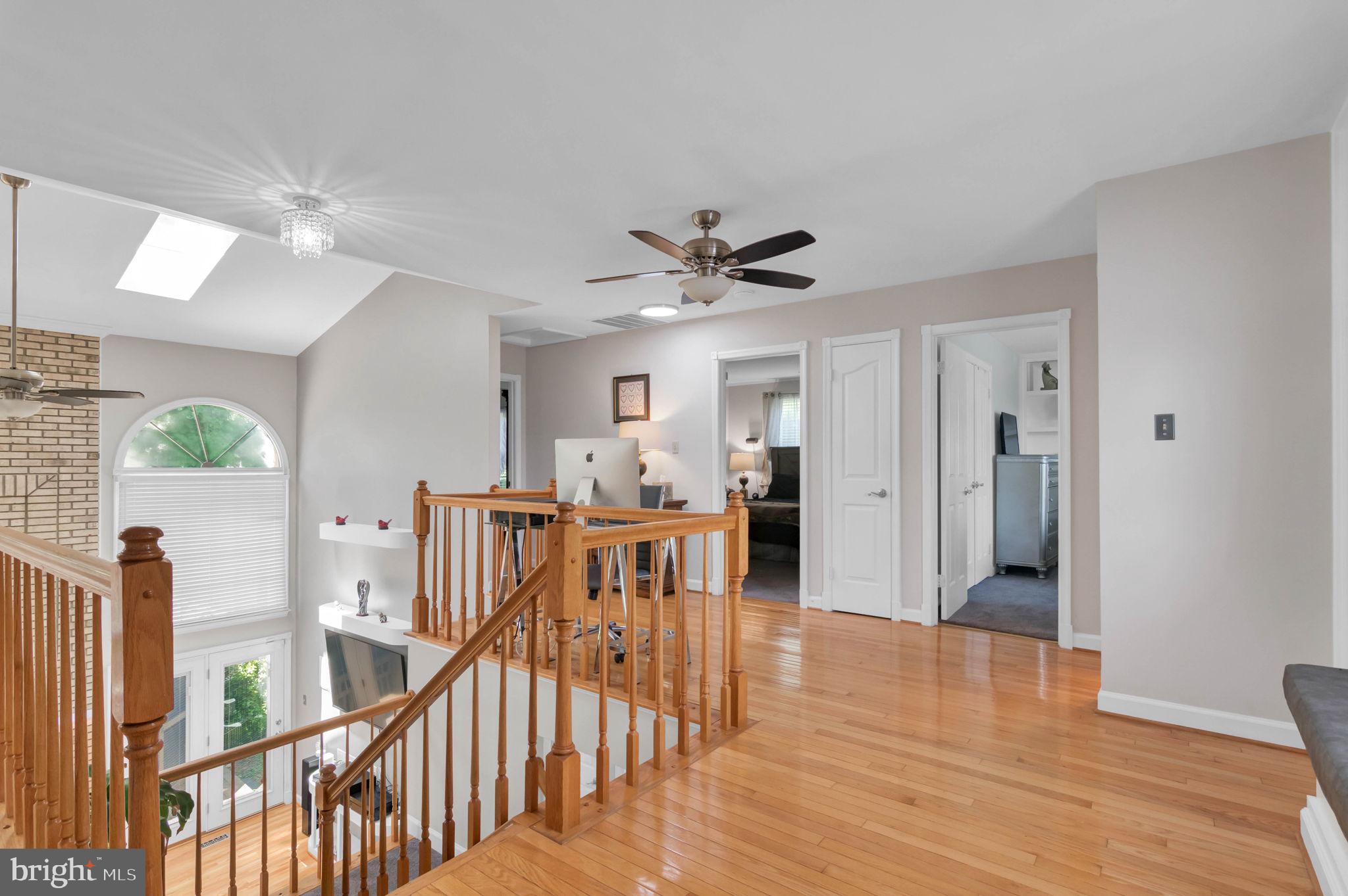 10404 Amherst Circle Fredericksburg, VA 22408 - Photo 44 of 74 a view of a livingroom with furniture wooden floor chandelier fan and windows