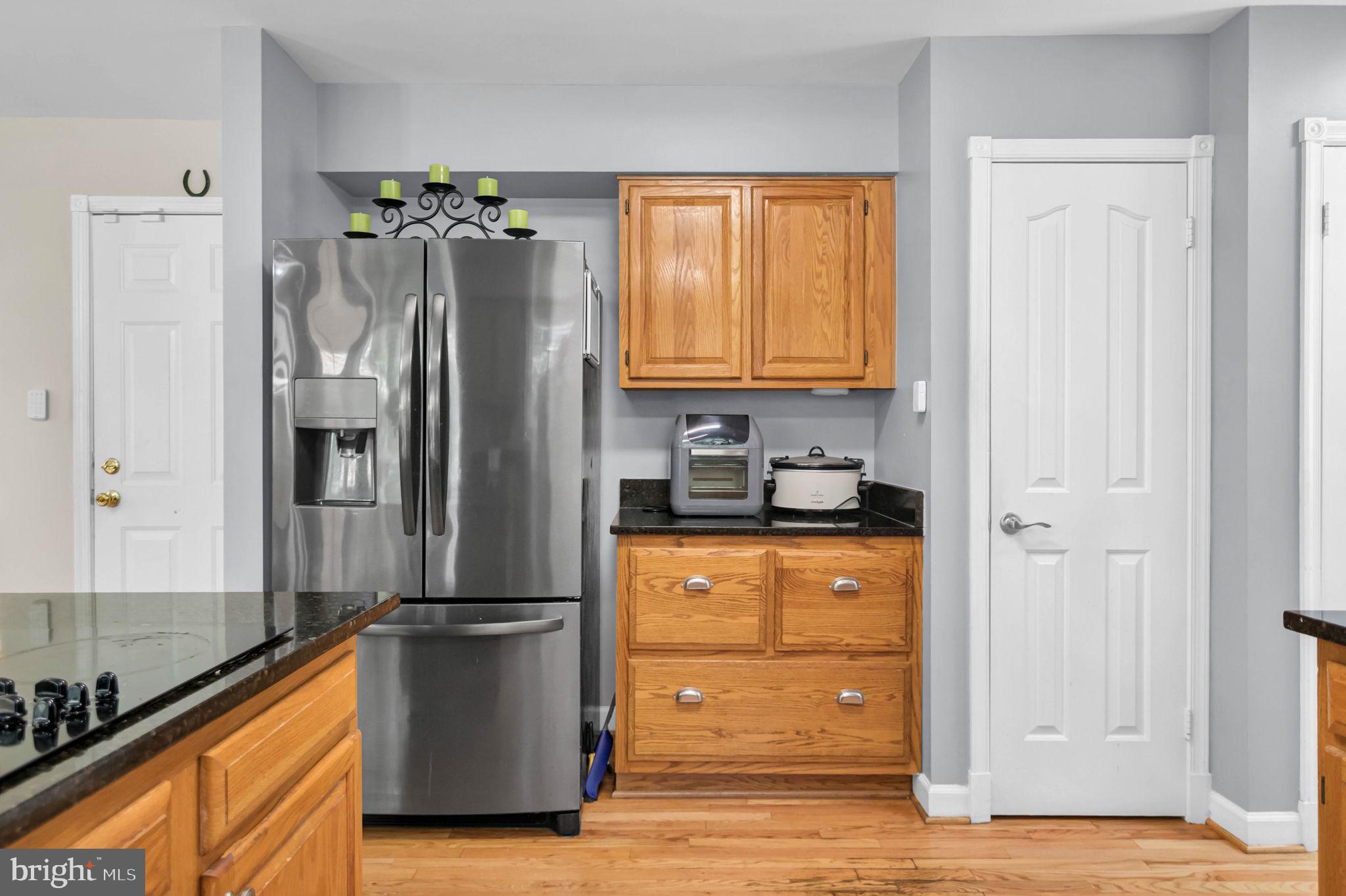 10404 Amherst Circle Fredericksburg, VA 22408 - Photo 59 of 74 a kitchen with stainless steel appliances granite countertop a refrigerator and a stove