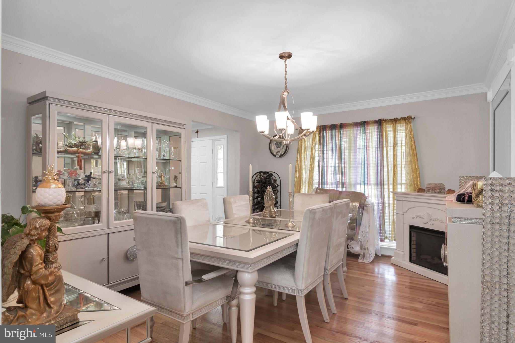 10404 Amherst Circle Fredericksburg, VA 22408 - Photo 62 of 74 a view of a dining room with furniture window and wooden floor