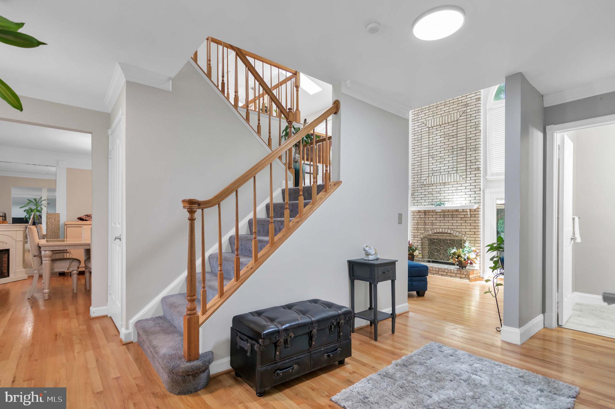 10404 Amherst Circle Fredericksburg, VA 22408 - Photo 63 of 74 a living room with furniture and a dining table with wooden floor