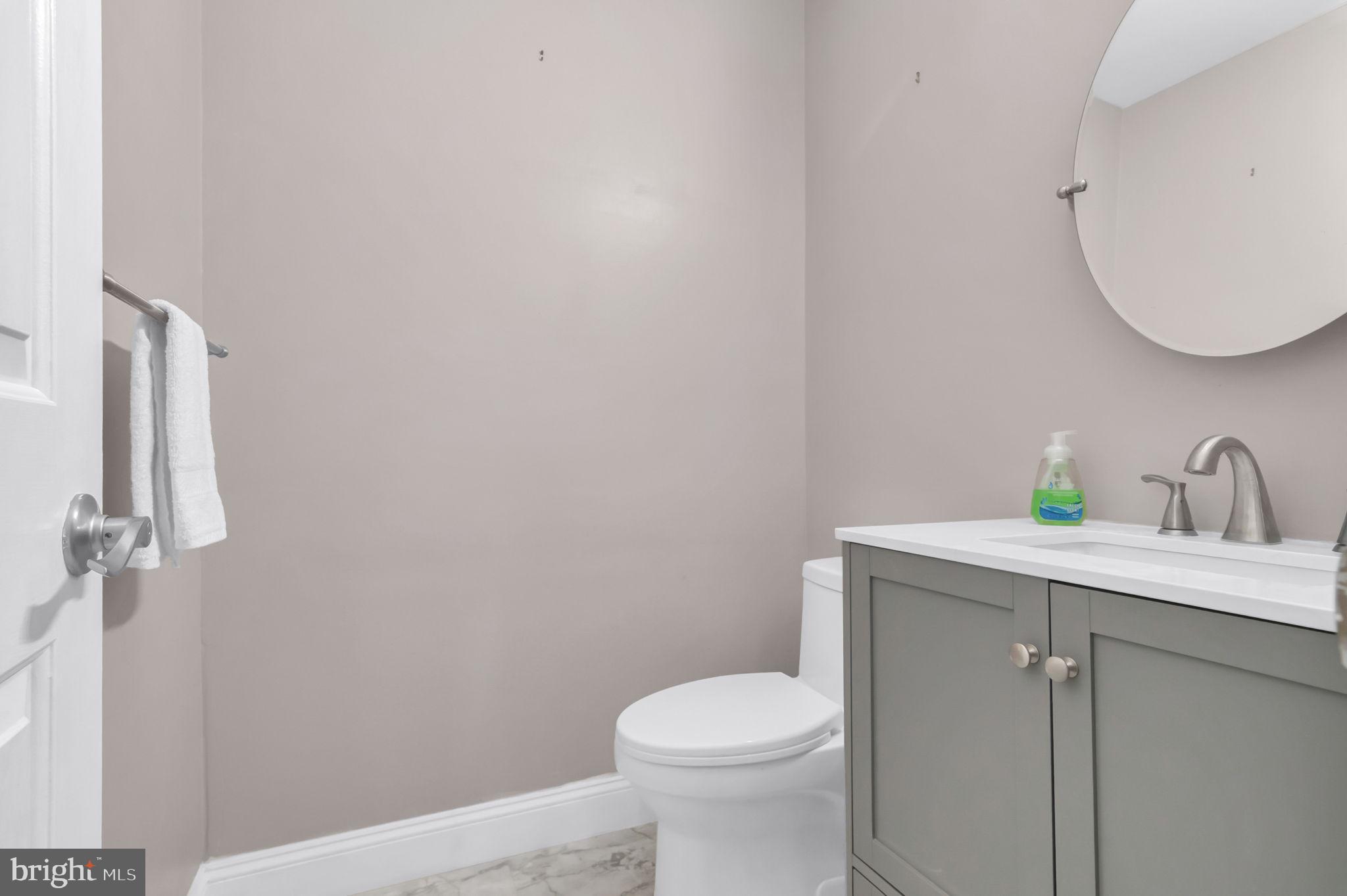 10404 Amherst Circle Fredericksburg, VA 22408 - Photo 64 of 74 a bathroom with a toilet sink and mirror