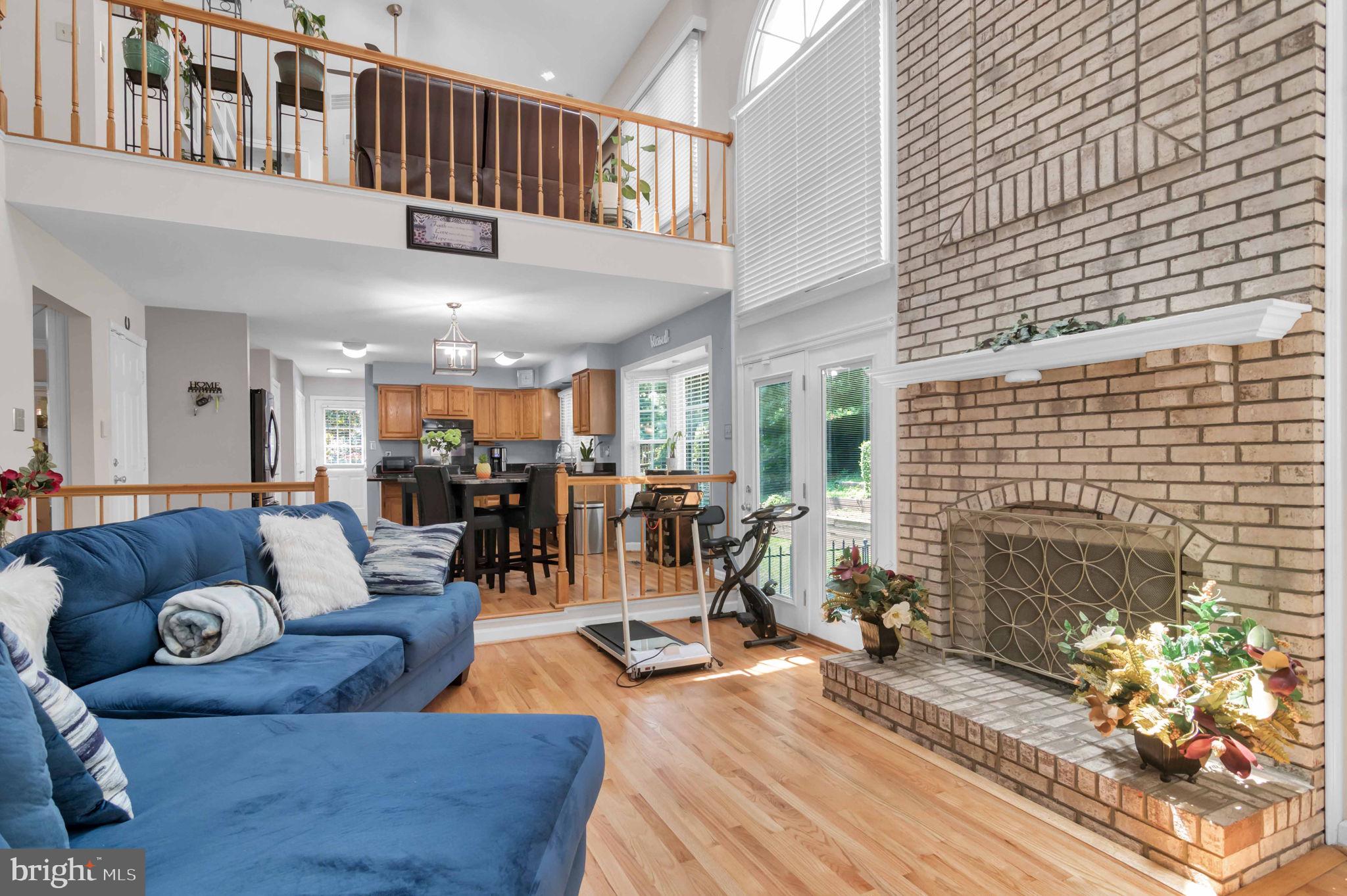 10404 Amherst Circle Fredericksburg, VA 22408 - Photo 66 of 74 a living room with furniture and a fireplace