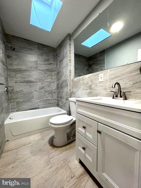 2437 West Toronto Street Philadelphia, PA 19132 - Photo 14 of 14 a bathroom with a toilet a sink and bathtub