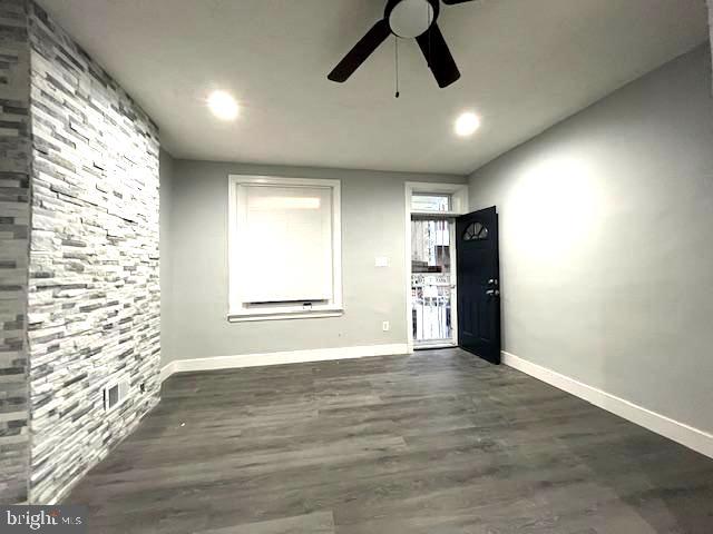 2437 West Toronto Street Philadelphia, PA 19132 - Photo 5 of 14 a view of an empty room with a window and wooden floor