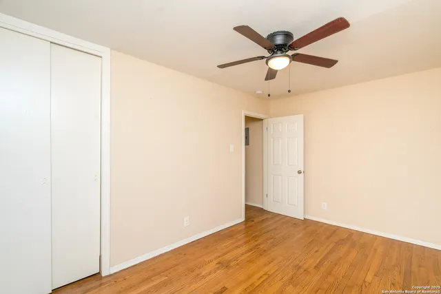 a view of cabinets and wooden floor