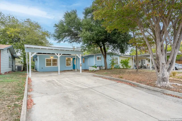 front view of a house with a trees