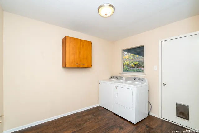a room with a stove and a painting on the wall