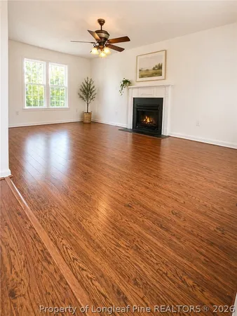 a view of a livingroom with furniture and a fireplace