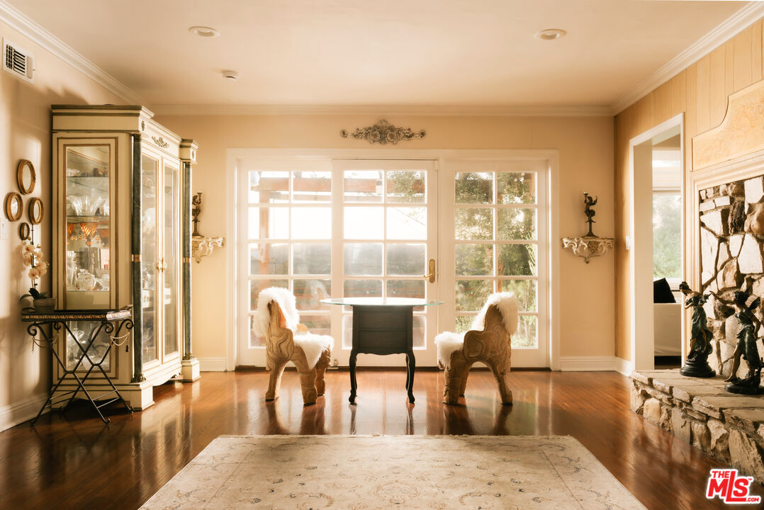 5741 Rolling Road Woodland Hills, CA 91367 - Photo 12 of 37 a living room filled with furniture window and wooden floor