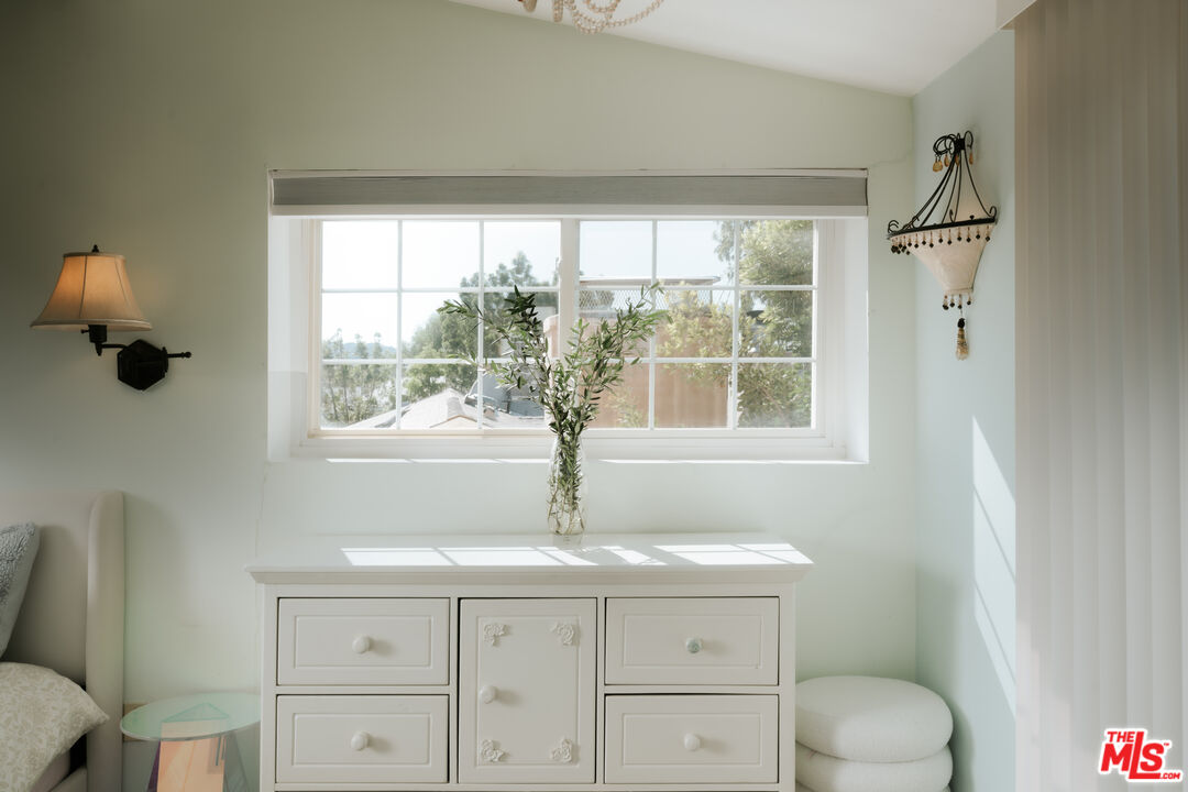 5741 Rolling Road Woodland Hills, CA 91367 - Photo 24 of 37 a bathroom with a toilet sink and mirror