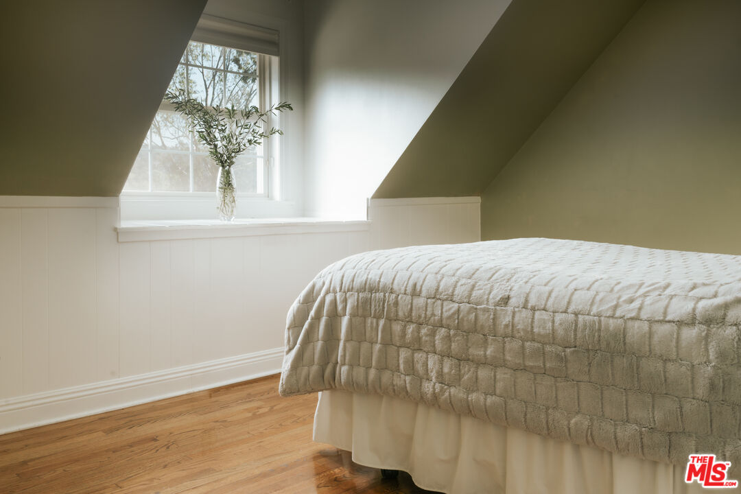 5741 Rolling Road Woodland Hills, CA 91367 - Photo 28 of 37 a bedroom with a bed and a window