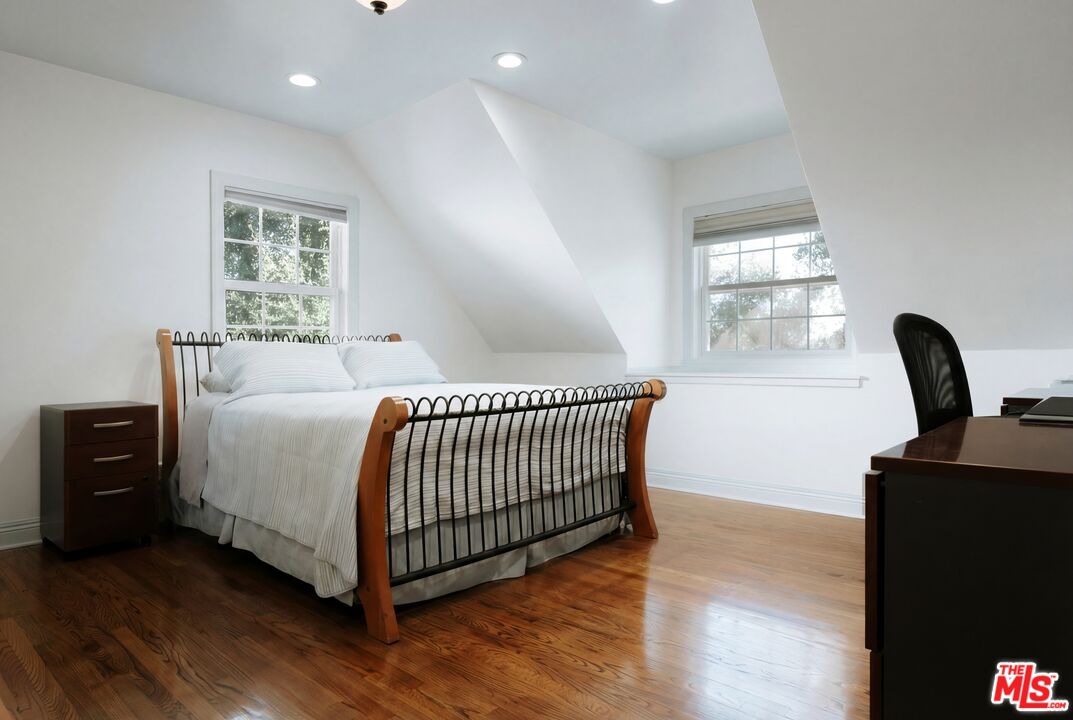 5741 Rolling Road Woodland Hills, CA 91367 - Photo 29 of 37 a bedroom with a bed and a window