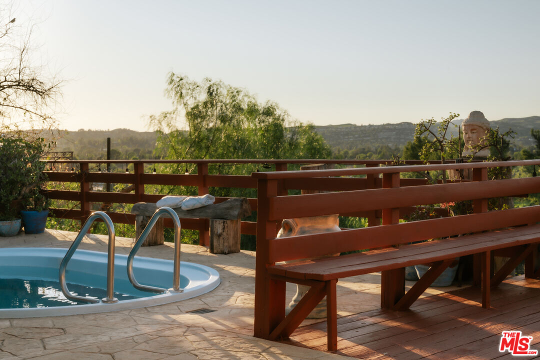 5741 Rolling Road Woodland Hills, CA 91367 - Photo 31 of 37 a view of a chairs and table on the terrace