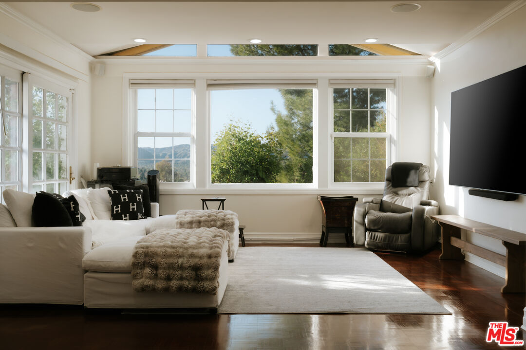 5741 Rolling Road Woodland Hills, CA 91367 - Photo 7 of 37 a living room with furniture and a flat screen tv