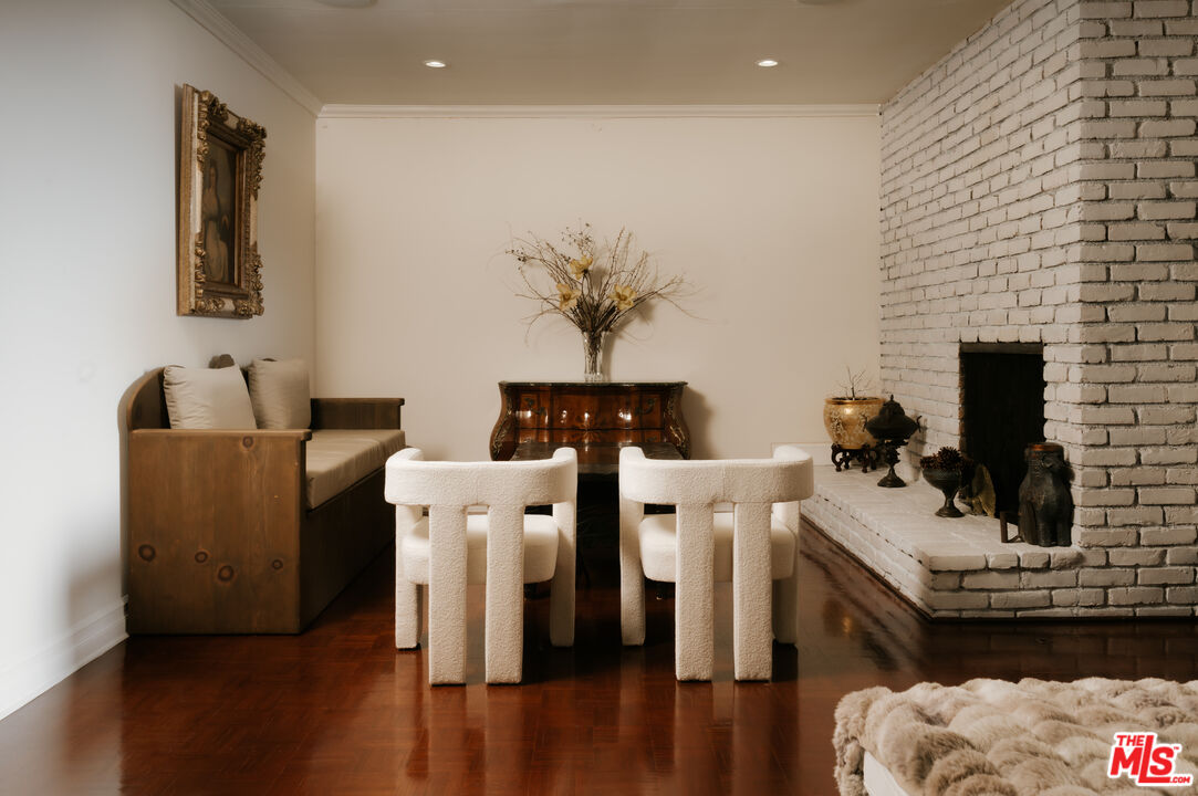 5741 Rolling Road Woodland Hills, CA 91367 - Photo 8 of 37 a living room with furniture and a fireplace