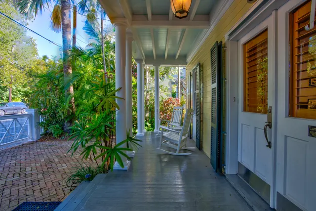 a view of a patio with swimming pool table and chairs