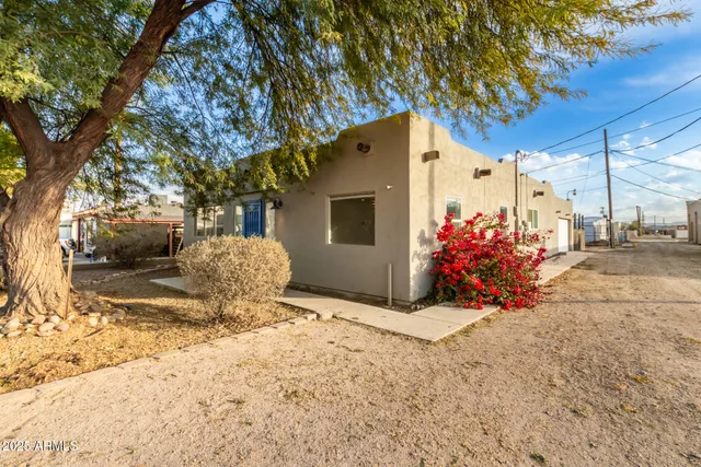 a view of a house with a snow in the yard