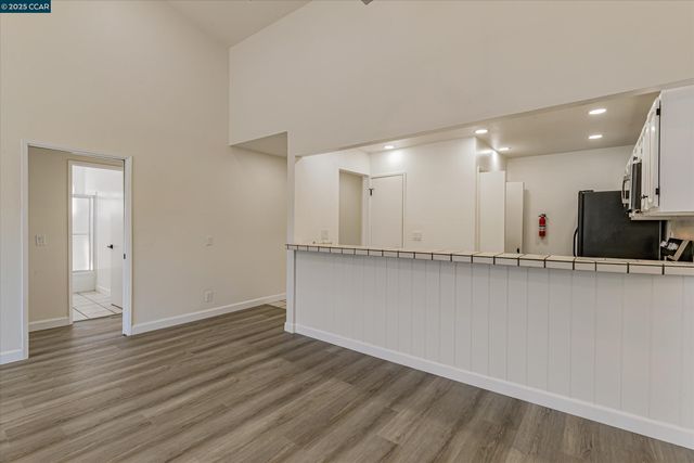 a kitchen with stainless steel appliances a refrigerator stove and microwave