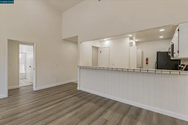 a kitchen with stainless steel appliances a refrigerator stove and microwave