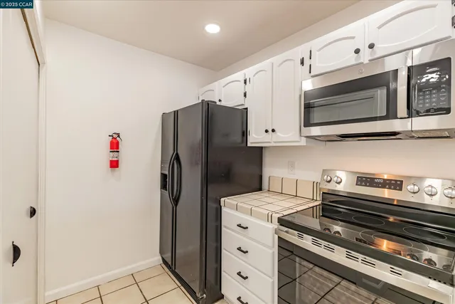 a bedroom with a large bed and a large window