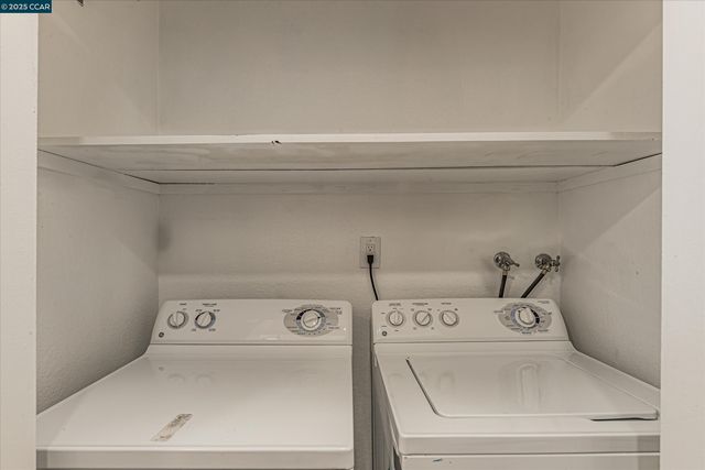 a view of a park with iron fence