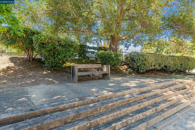 an aerial view of a house with a yard and garden space