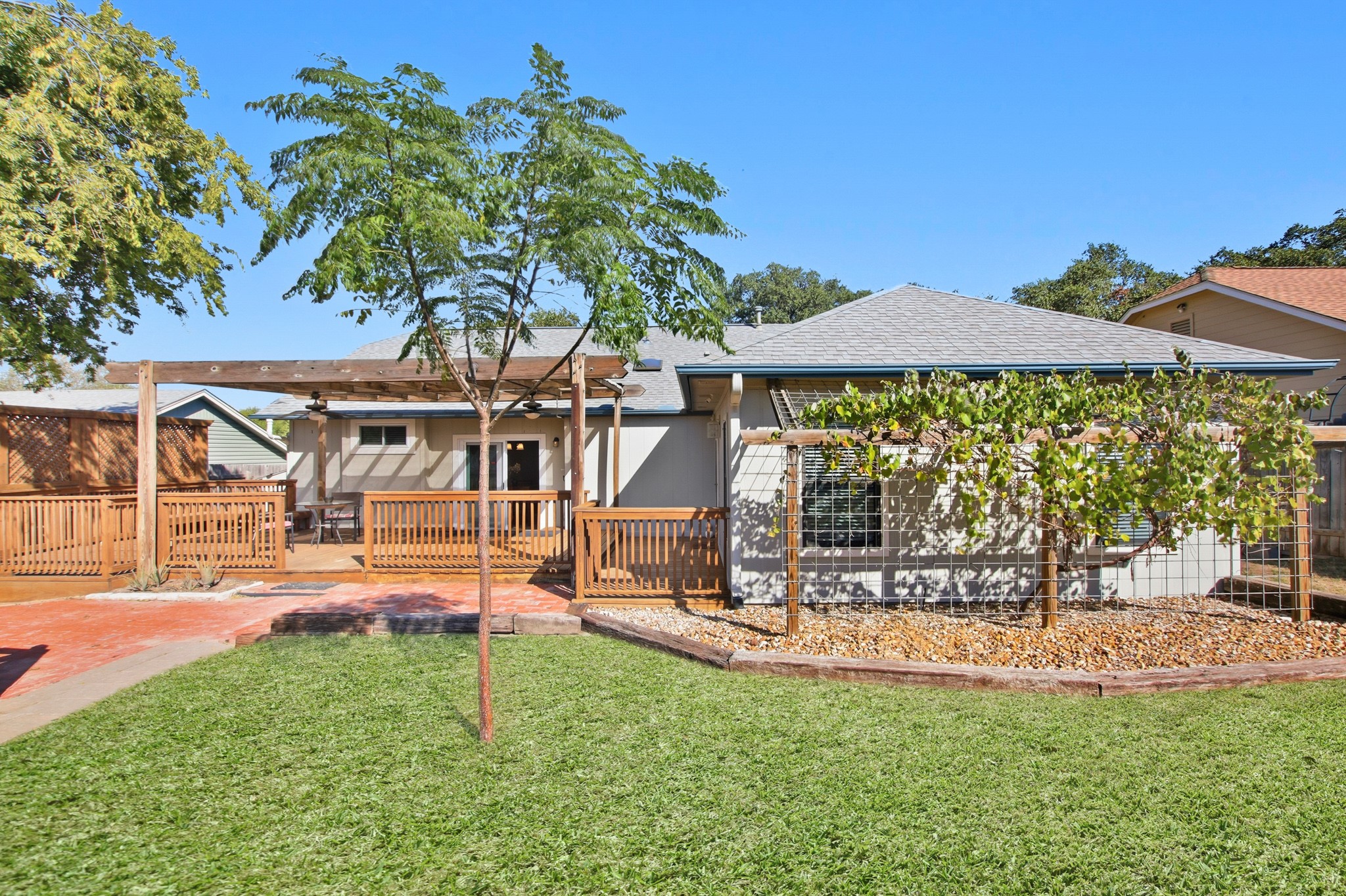 1711 Prairie Hen Cove Austin, TX 78758 - Photo 18 of 18 Rear view of property with a shingled roof