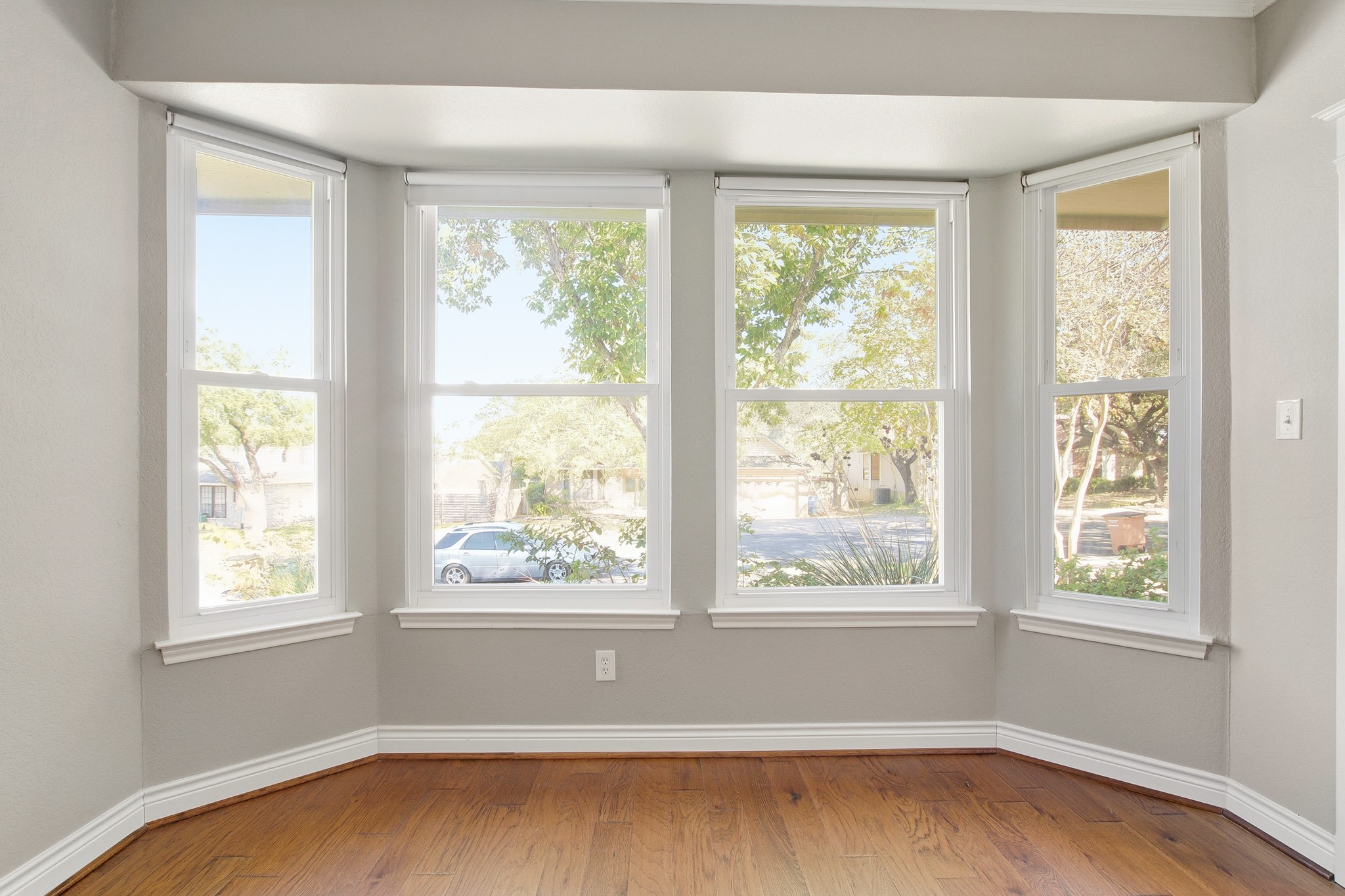 1711 Prairie Hen Cove Austin, TX 78758 - Photo 10 of 18 Spare room featuring baseboards and wood finished floors