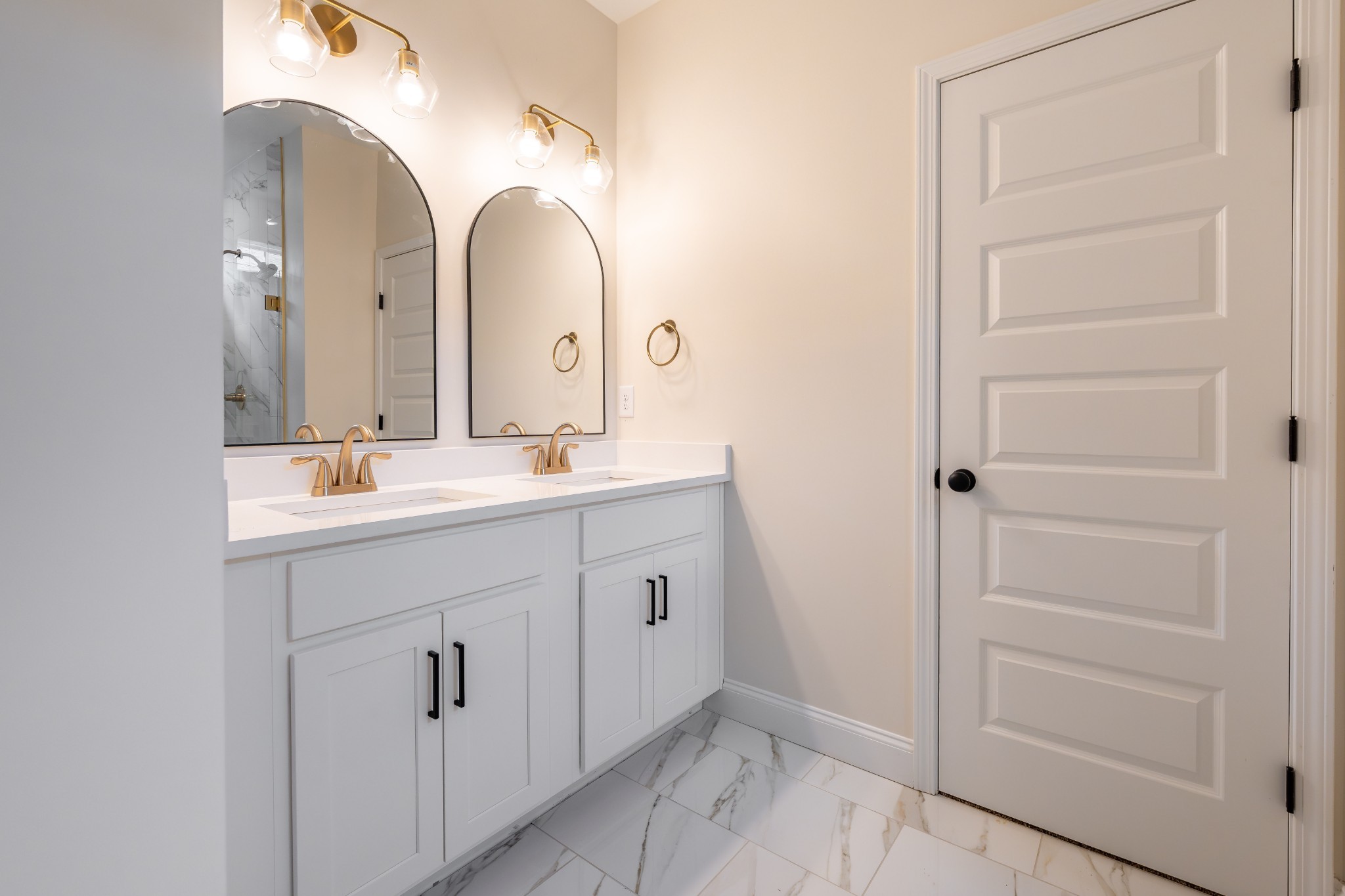 579 Centre Street Pleasant View, TN 37146 - Photo 11 of 36 a spacious bathroom with a double vanity sink and a mirror