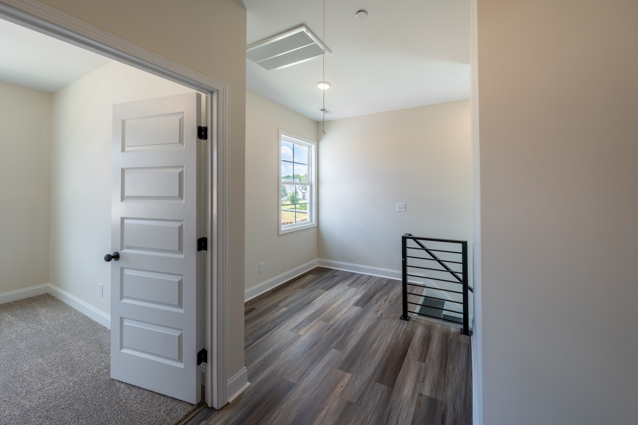579 Centre Street Pleasant View, TN 37146 - Photo 19 of 36 an empty room with wooden floor closet and windows