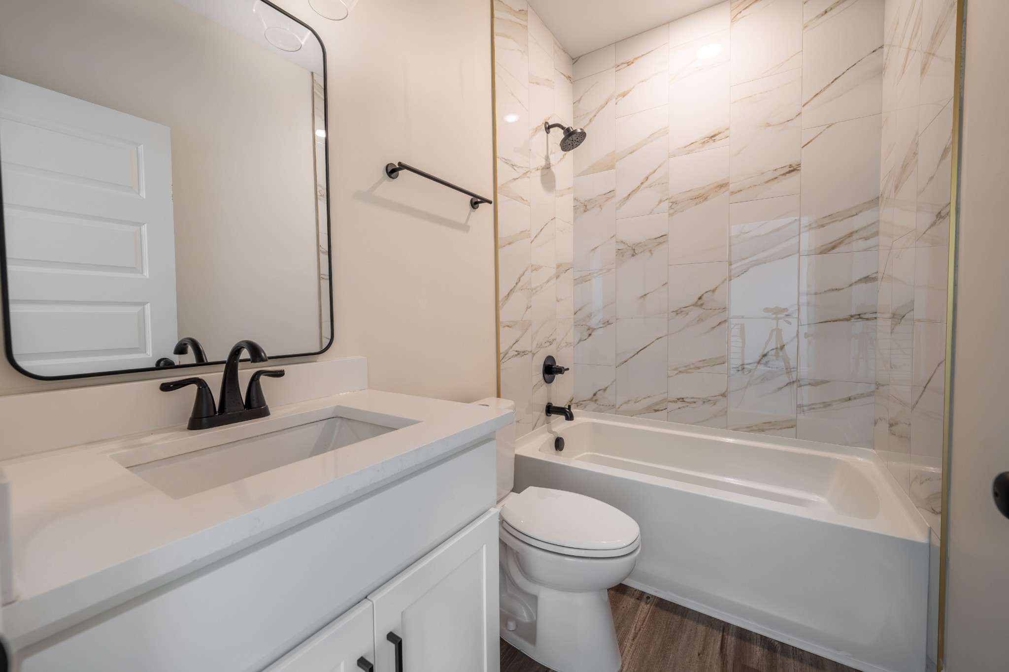 579 Centre Street Pleasant View, TN 37146 - Photo 30 of 36 a bathroom with a sink a toilet and a bathtub
