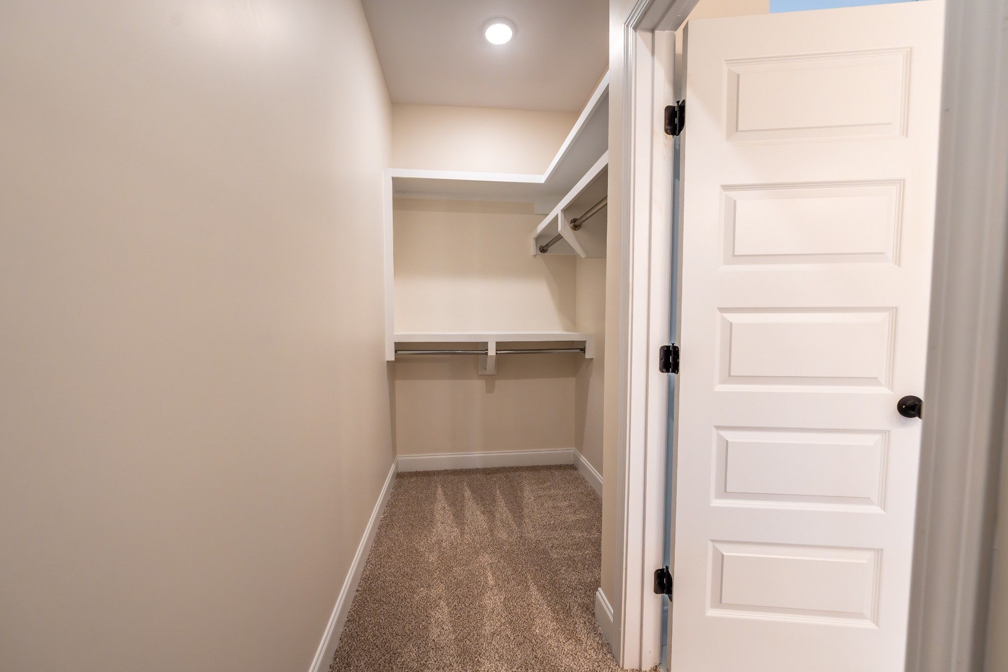 579 Centre Street Pleasant View, TN 37146 - Photo 31 of 36 a view of walk in closet with empty racks