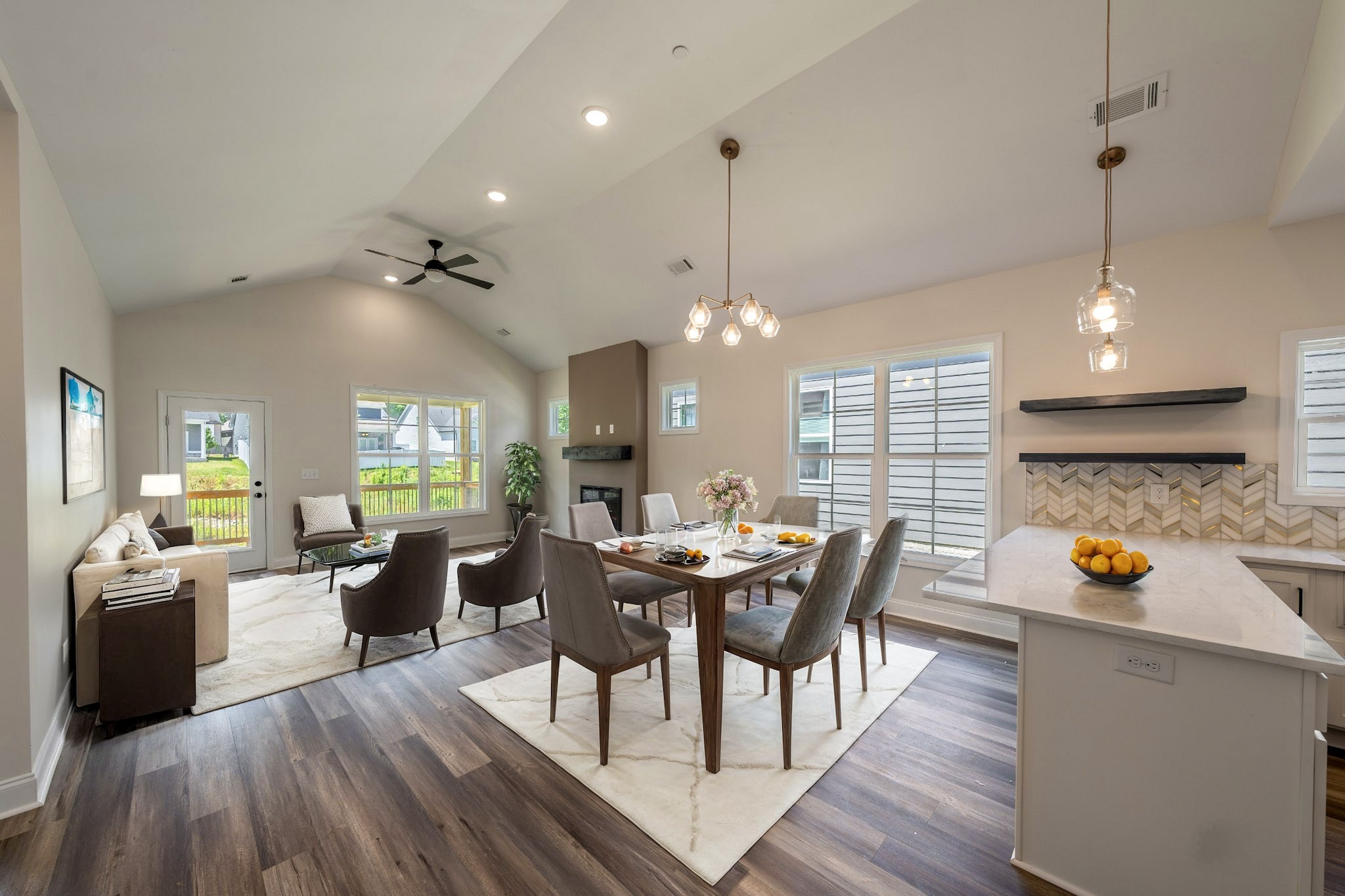 579 Centre Street Pleasant View, TN 37146 - Photo 5 of 36 a view of a dining room and livingroom with furniture wooden floor a chandelier