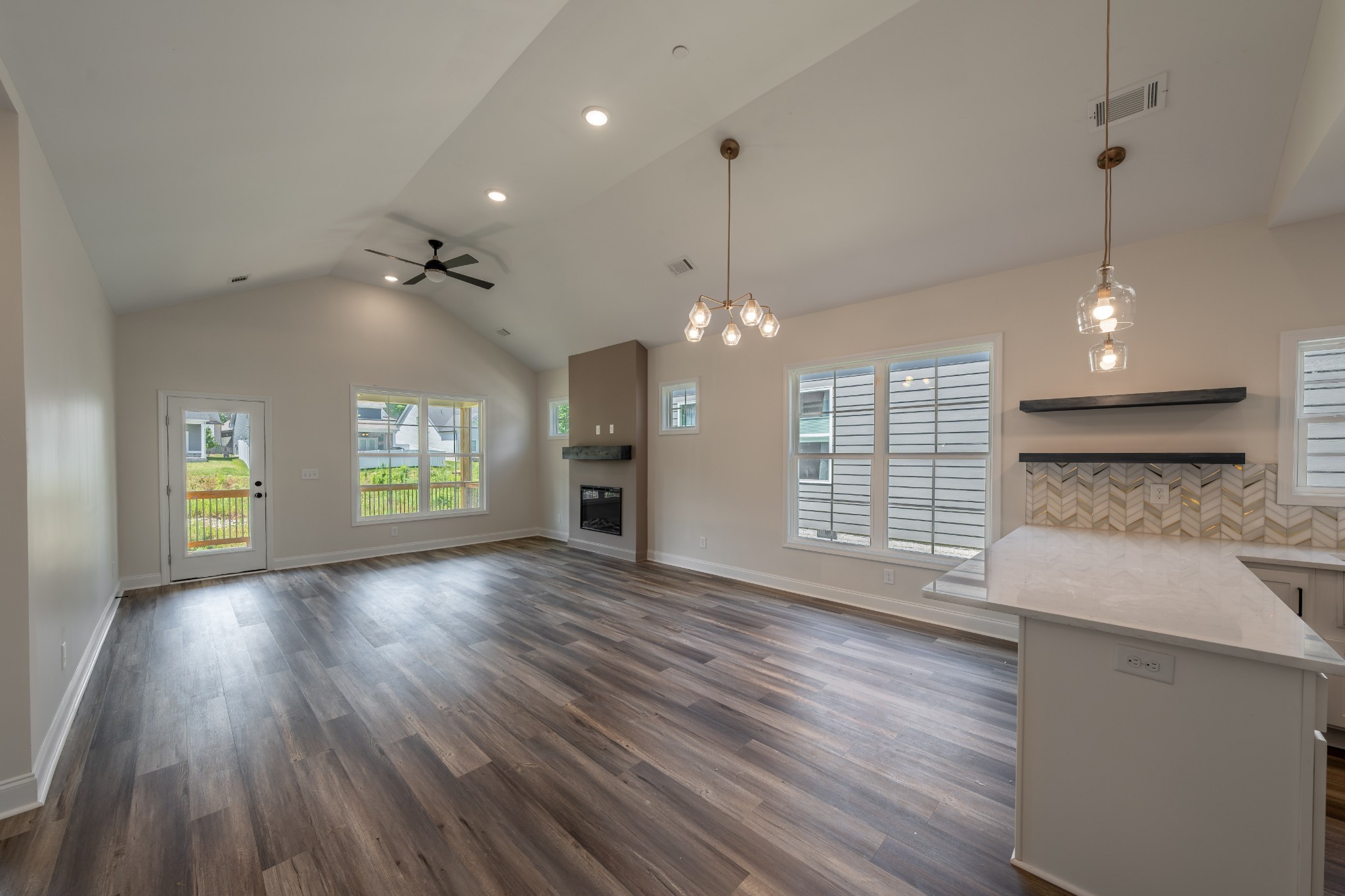 579 Centre Street Pleasant View, TN 37146 - Photo 6 of 36 a view of an empty room with window and wooden floor