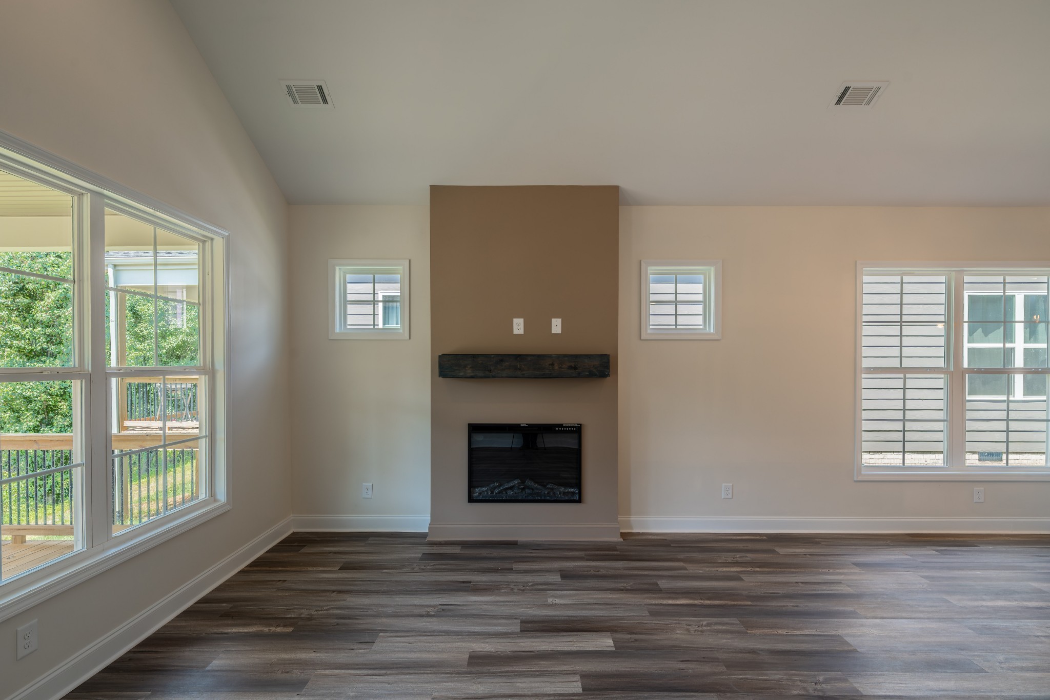579 Centre Street Pleasant View, TN 37146 - Photo 7 of 36 a view of an empty room with wooden floor and a window