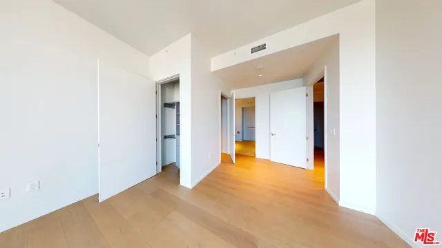 a bathroom with a sink mirror vanity and toilet