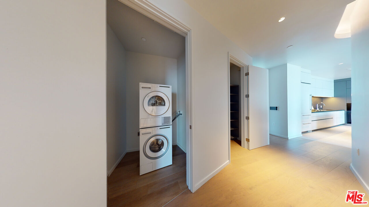 2801 Sunset Place, Unit PH15 Los Angeles, CA 90005 - Photo 18 of 23 a view of a storage & utility room with washer and dryer
