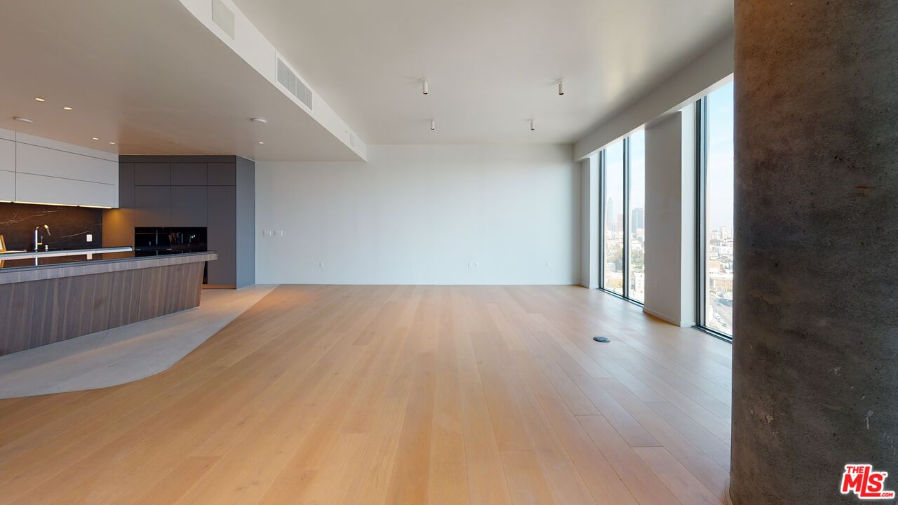 2801 Sunset Place, Unit PH15 Los Angeles, CA 90005 - Photo 8 of 23 a view of a kitchen with a sink and a window