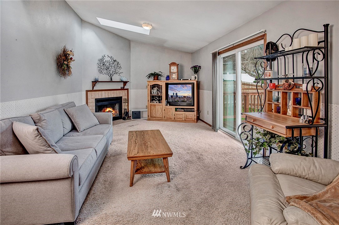 23431 12th Place West Bothell, WA 98021 - Photo 13 of 26 a living room with furniture and a couch