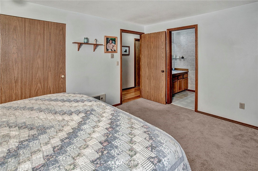 23431 12th Place West Bothell, WA 98021 - Photo 16 of 26 a bedroom with a bed and a bathroom