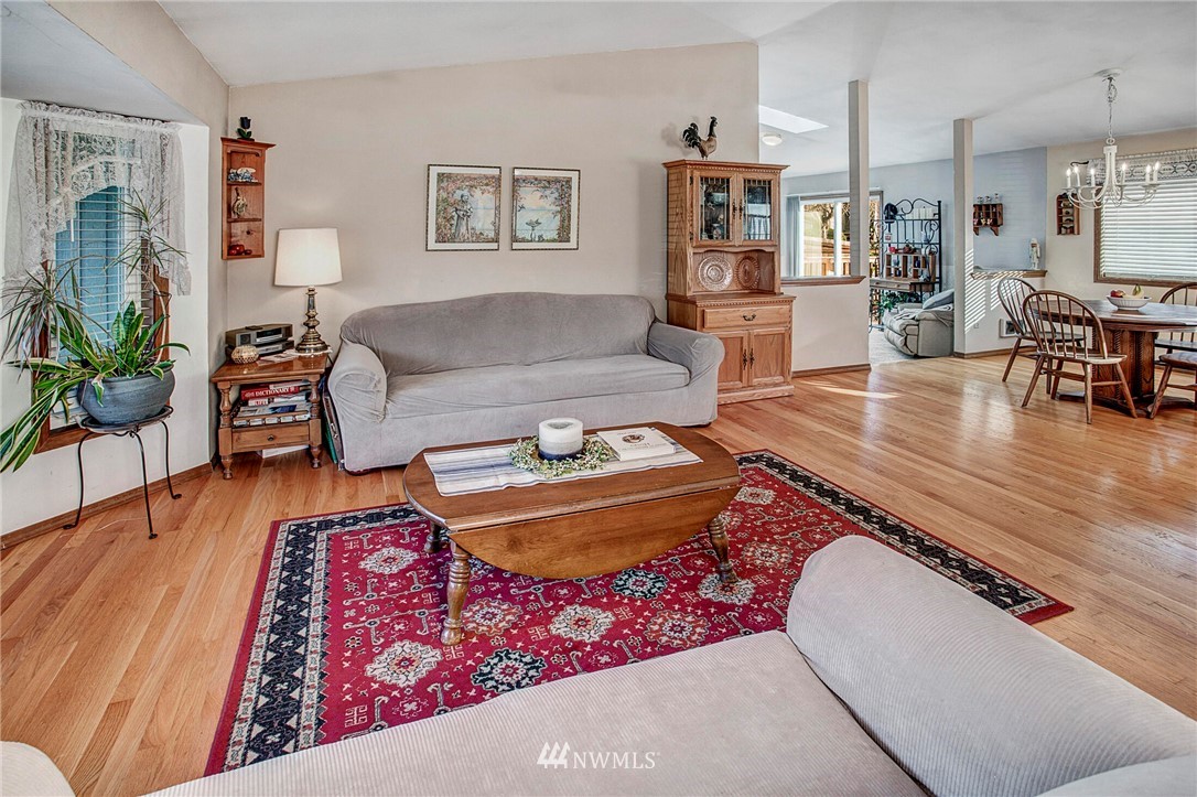 23431 12th Place West Bothell, WA 98021 - Photo 3 of 26 a living room with furniture and a wooden floor