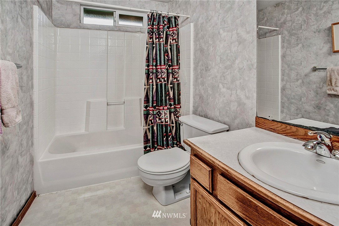 23431 12th Place West Bothell, WA 98021 - Photo 21 of 26 a bathroom with a sink a toilet and shower