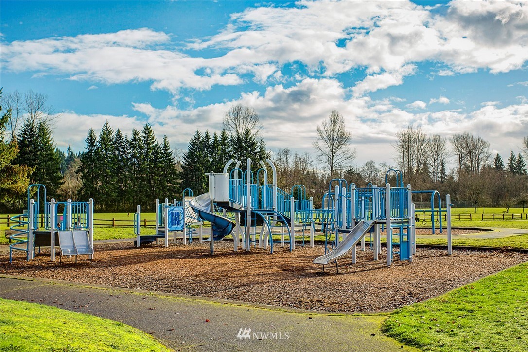23431 12th Place West Bothell, WA 98021 - Photo 24 of 26 a view of a park with swings and slides