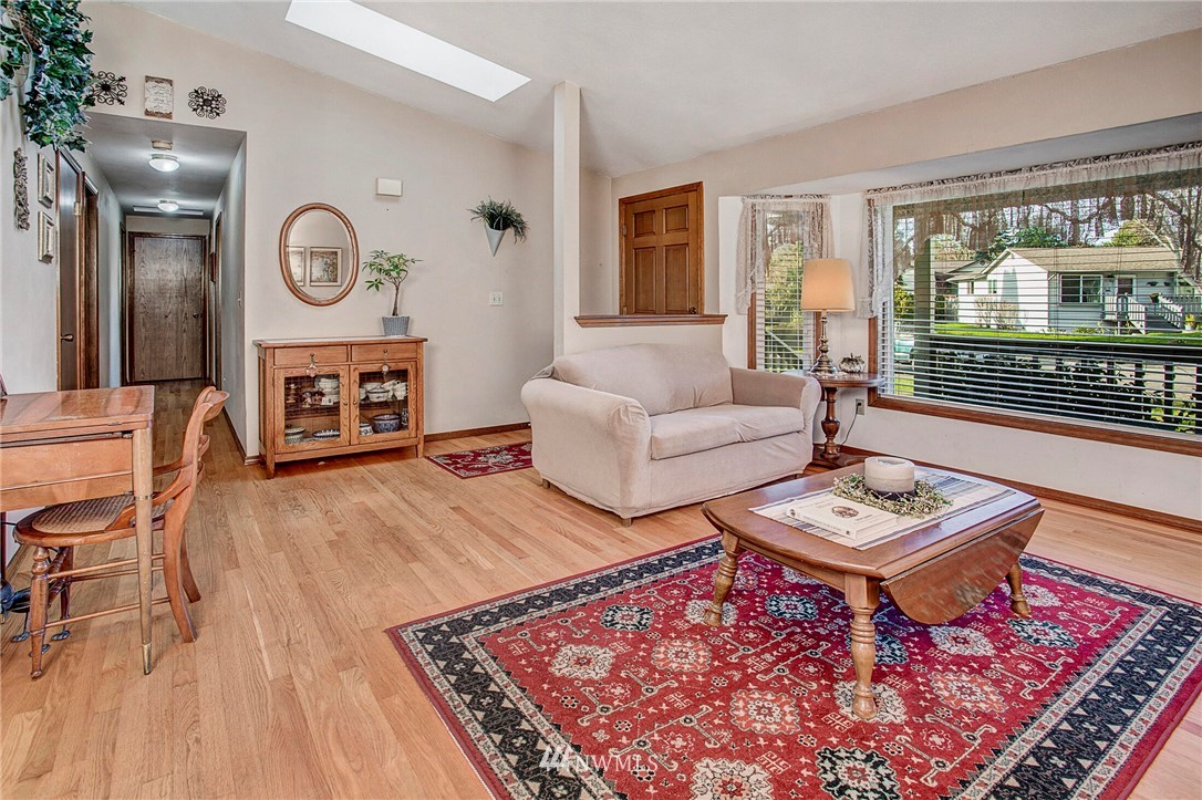 23431 12th Place West Bothell, WA 98021 - Photo 5 of 26 a living room with furniture a rug and a window