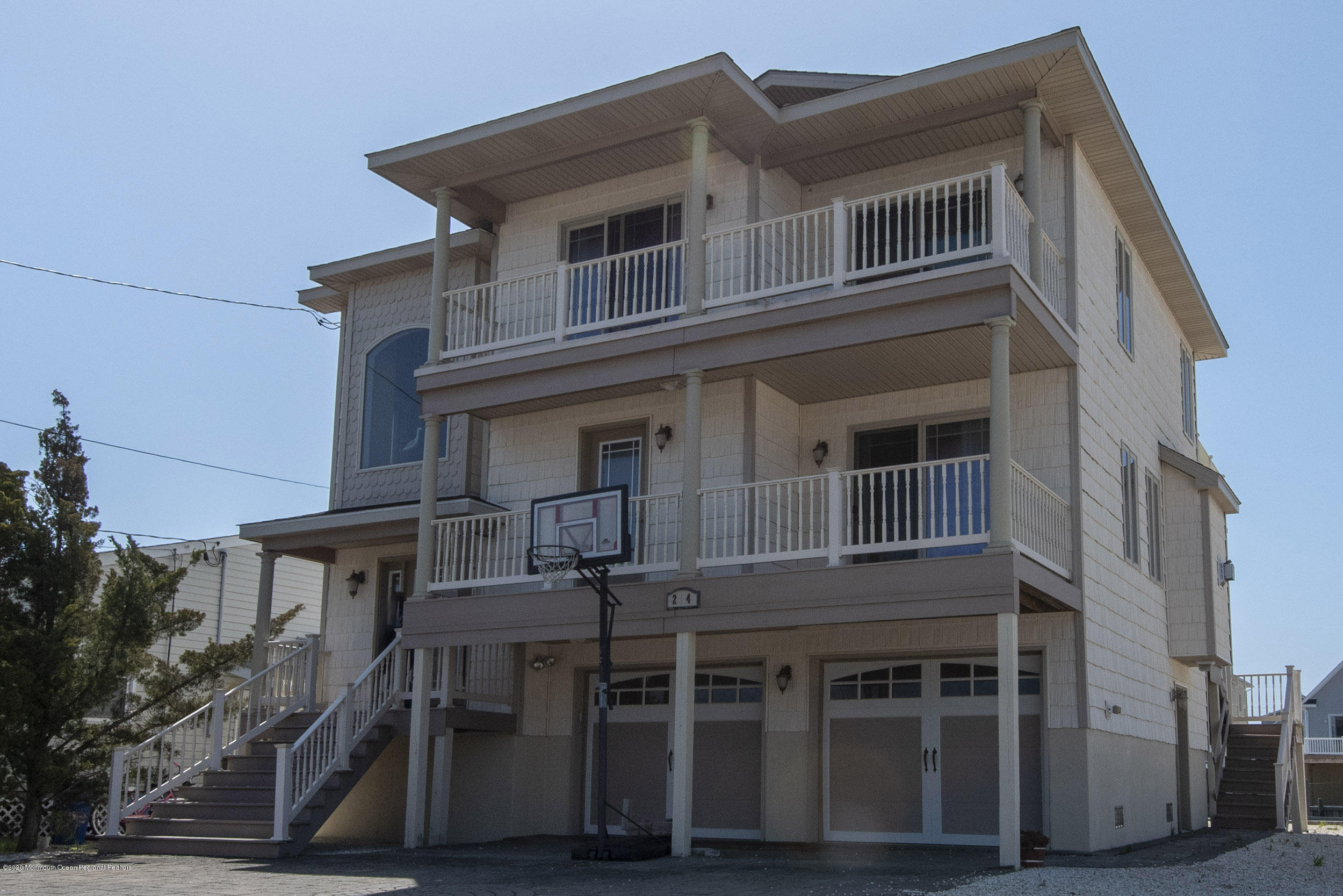 214 Heron Road Tuckerton, NJ 08087 - Photo 1 of 31 a tall building with a lot of windows