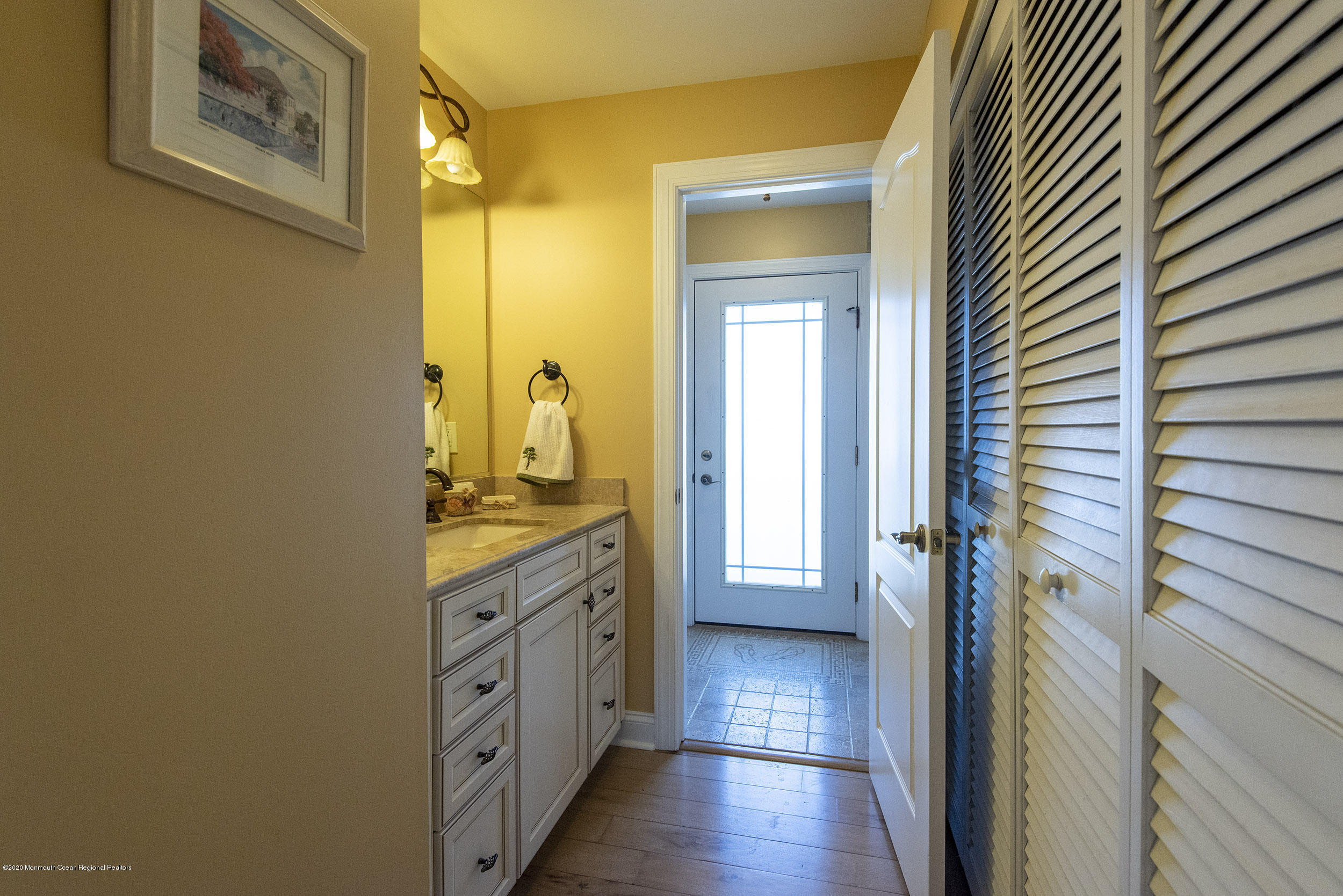 214 Heron Road Tuckerton, NJ 08087 - Photo 13 of 31 a bathroom with a granite countertop sink and a mirror