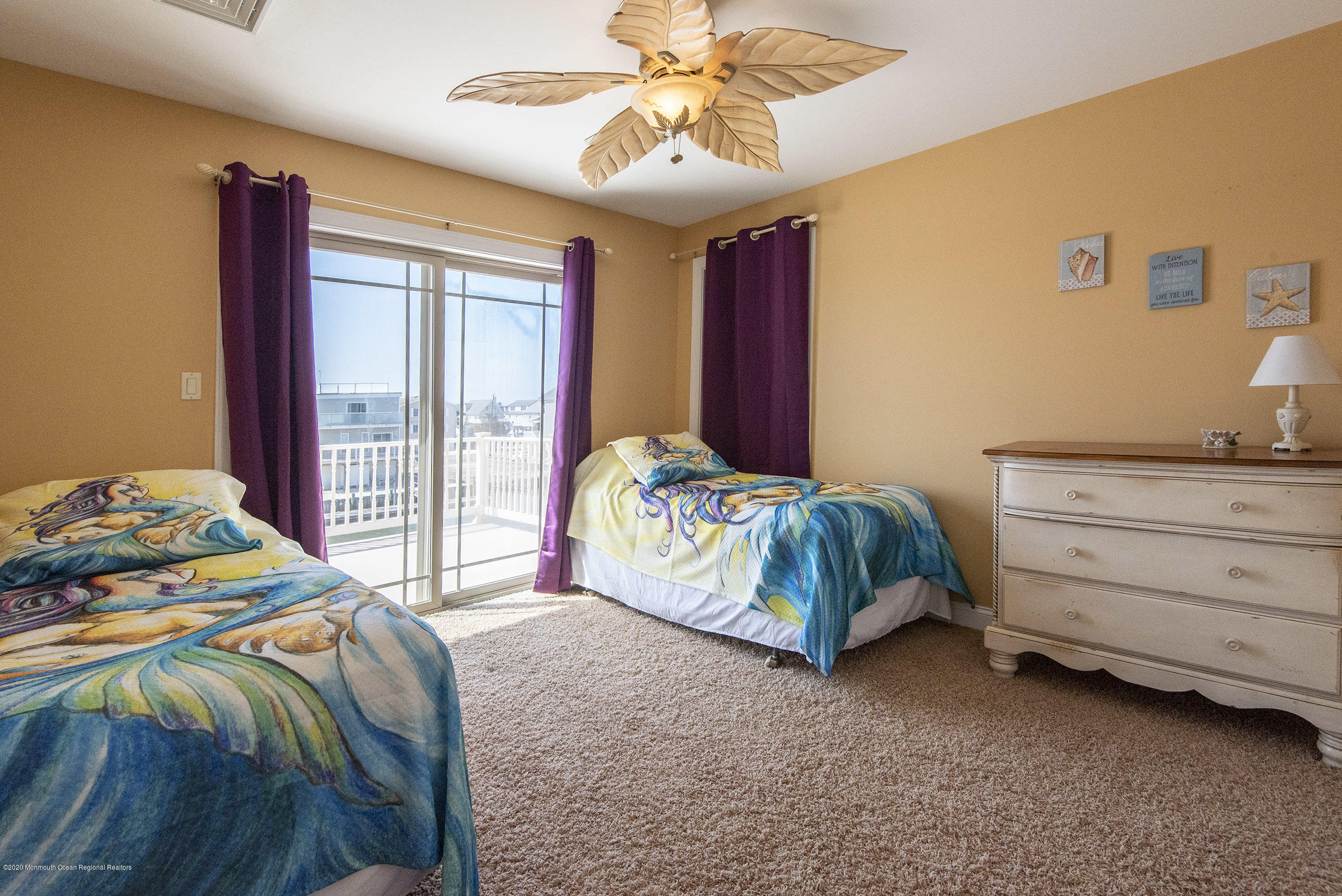 214 Heron Road Tuckerton, NJ 08087 - Photo 18 of 31 a bedroom with a bed and a chandelier